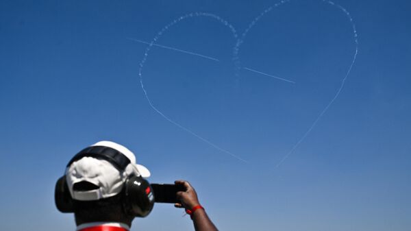 The Indian Air Force (IAF) Surya Kiran aerobatics team performs during the inaugural day of the 14th edition of 'Aero India 2023' airshow at the Yelahanka air force station in Bengaluru on February 13, 2023. - Sputnik India