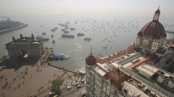 In this Nov 17, 2018 photo, the iconic Taj Mahal Palace hotel, the epicenter of the 2008 terror attacks that killed 166 people, with its imposing, red-tiled dome, overlooks the Gateway of India monument, left, in Mumbai, India. - Sputnik India