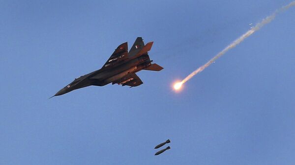 An Indian Air Force (IAF) MIG 29 releases bombs during an air exercise named 'Vayu Shakti-2019', or air power, at Pokhran, in the western Indian state of Rajasthan, Saturday, Feb. 16, 2019 - Sputnik India
