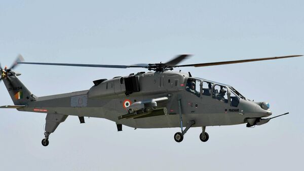 ndian Defence Minister Rajnath Singh sits inside India's first indigenously developed light combat helicopter named Prachand during its induction ceremony in Jodhpur, India, Monday, Oct.3, 2022. - Sputnik India