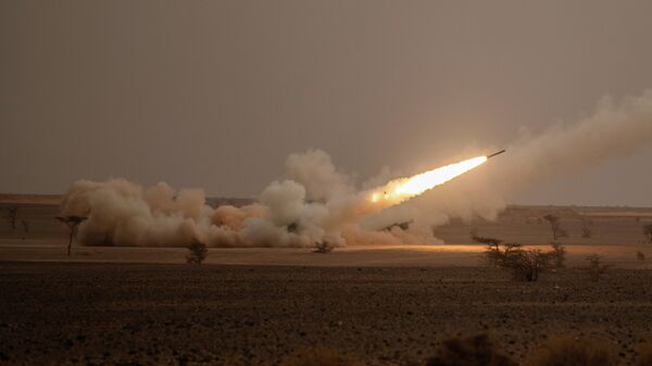 A launch truck fires the High Mobility Artillery Rocket System (HIMARS) at its intended target during the African Lion military exercise in Grier Labouihi complex, southern Morocco, on June 9, 2021. - Sputnik India