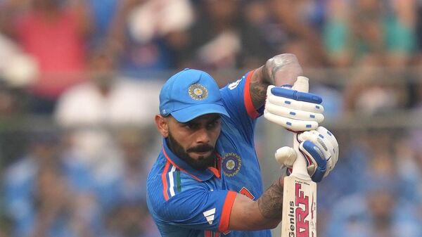 India's Virat Kohli plays a shot during the ICC Men's Cricket World Cup first semi final match between India and New Zealand in Mumbai, India, Wednesday, Nov. 15, 2023. - Sputnik India