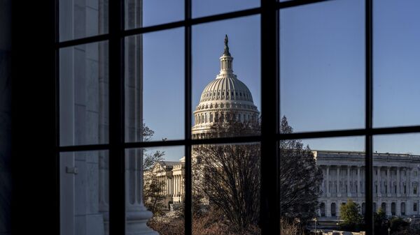 The U.S. Capitol is seen through a window in the Russell Senate Office Building in Washington, March 15, 2023.  - Sputnik India