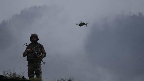 A drone hovers near an Indian soldier's outpost at Pir Panjal Pass during a media tour arranged by the Indian army in Jammu and Kashmir's Poonch district, India, Saturday, Aug.12, 2023. (AP Photo/Channi Anand) - Sputnik India