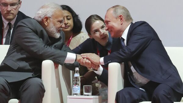 Russian President Vladimir Putin, right, shakes hands with Indian Prime Minister Narendra Modi before the International Jigoro Kano Judo Tournament at the 5th Eastern Economic Forum in Vladivostok, Russia, on Thursday, Sept. 5, 2019. Russian far-eastern city of Vladivostok hosts the Eastern Economic Forum on September 4-6. (Mikhail Klimentyev, Sputnik, Kremlin Pool Photo via AP) - Sputnik India