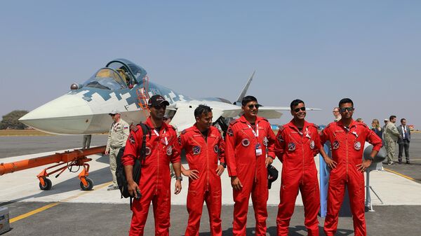 The Indian aerobatic team poses for a photo next to the Russian Su-57 fighter at the XV Aero India 2025 International Aerospace Exhibition, held at the Indian Air Force base in Yelahanka. Nina Padalko / Sputnik - Sputnik India